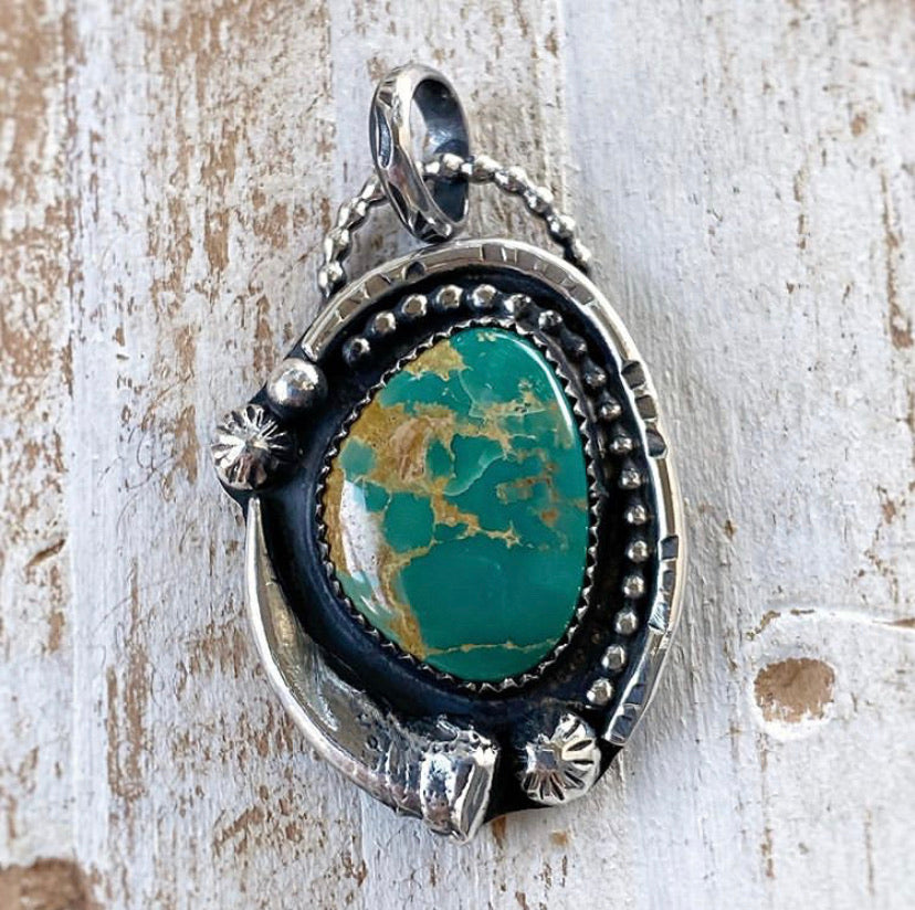 turquoise pendant with badger claw casting